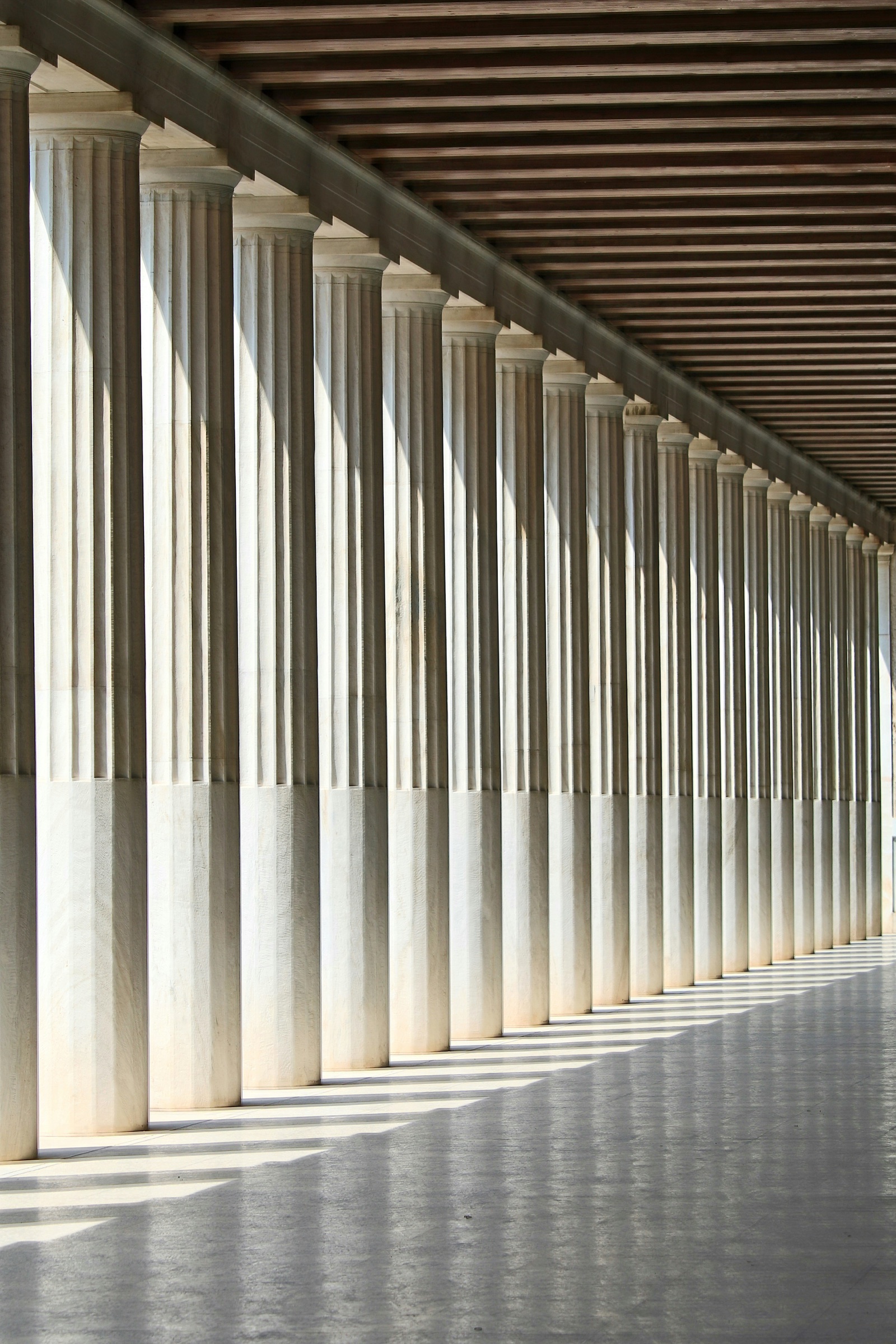 A white colonnade and an empty hallway in daylight